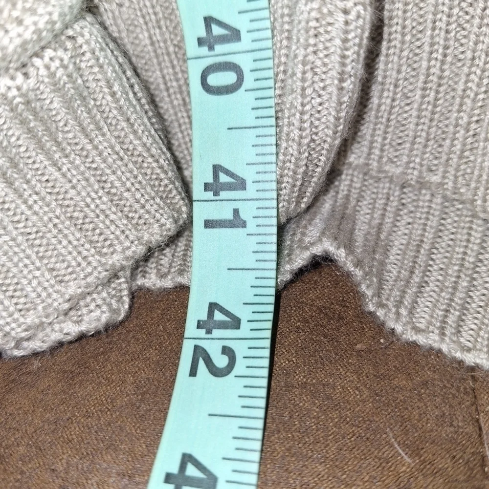 A Calvin Klein faux wrap ribbed knitted sweater dress in a ladies size medium.
